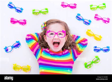 Child Wearing Eye Glasses Eye Wear For Kids Little Girl Choosing