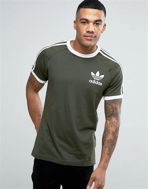 Footwear, apparel, exclusives and more from brands like nike, jordan, adidas, vans, and champion. Adidas originals California T-shirt In Green Bq5369 in ...
