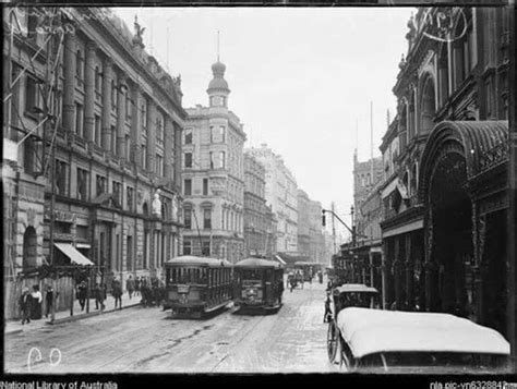 An Old Black And White Photo Of A City Street