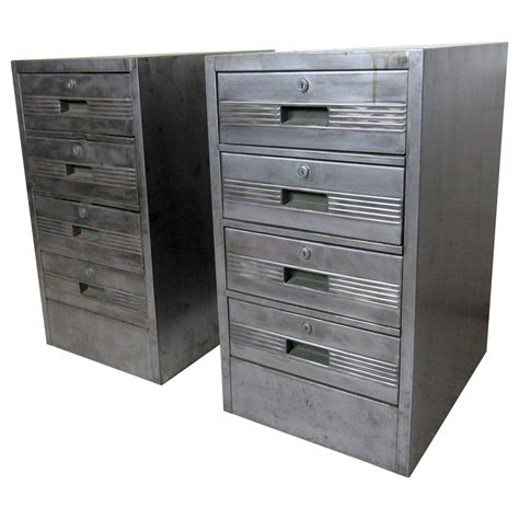 It has an extract rack and hooks for can opener, ice book and milk bottle opener on the upper right door. Vintage Metal Hoosier Cabinet at 1stDibs