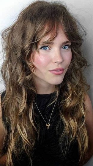 Curtain bangs have made their way onto the list of hair trends to love this year and we're excited to see the wispy bang hairstyle take for curly girls, shrinkage isn't a worry due to the length of curtain bangs. Curtain Bangs Hairstyles We Love