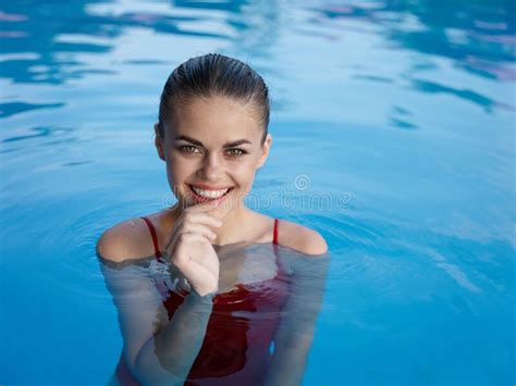 Cheerful Woman Swimming In The Pool Luxury Travel Nature Stock Image