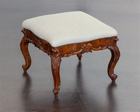 Lot A Carved Mahogany Foot Stool With White Upholstery X X