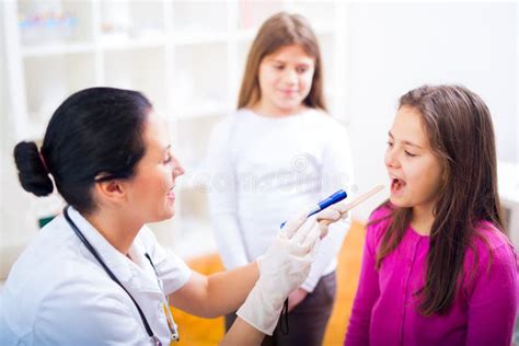 Female Doctor And Patient Teenagers Stock Photo Image Of Illness