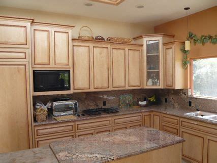 Very popular, clean and contemporary shaker door cabinets stained natural finish! natural kitchen cabinets | Kitchen is shown in Maple with Pinnacle Doors/Drawer Fronts. It's a ...