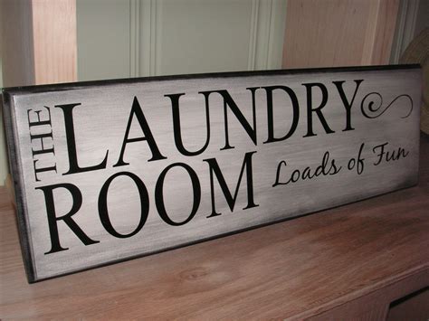 In a modern home, a laundry room would be equipped with an automatic washing machine and clothes dryer, and often a large basin, called a laundry tub. The Laundry Room Loads of Fun Sign