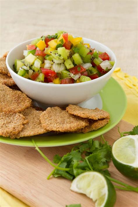 Corn tortillas are cut into quarters, coated with a bit of oil and lime juice. Corn-free Tortilla Chips and Summer Salsa | Healthful Pursuit