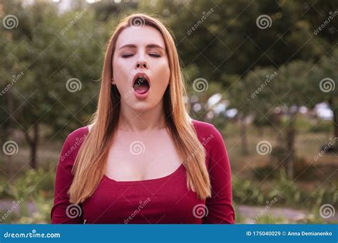 woman imitate orgasmic face she wear casual but outfit and standing in park stock image image