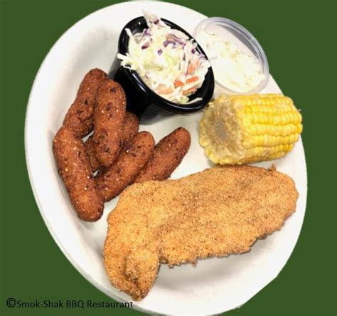 The fried catfish—and plenty of it—is usually served as a complete dinner with slaw, hush puppies, and french fries. Smok-Shak Friday Special - Fried Catfish served with coleslaw, corn on the cob, and hush puppies ...