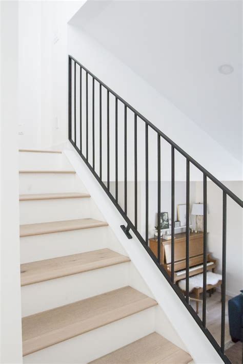 The set up is very elegant because it brings out the beauty of natural brown wood amongst the whiteness you can include a simple stair railing for a small staircase with a small desk underneath. Modern Metal Railings + A Sleek Staircase Design ...