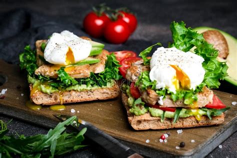 Delicious Sandwich With Avocado And Poached Egg Stock Photo Image Of