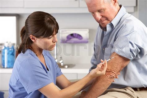 Doctor Giving Male Patient Injection Stock Image Colourbox