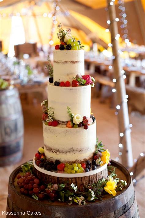 Semi naked wedding cake with fresh fruit and flowers - - CakesDecor