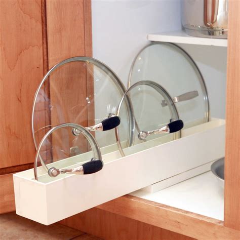 You can store up to four lids upright and the metal supports mean that they don't need to rely on each other for stability. A Kitchen Organizing Challenge: Pot Lids - Core77