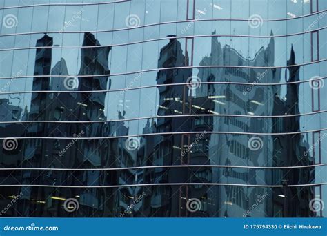 Reflection And Reflection On The Glass Wall Of The Building Stock Photo