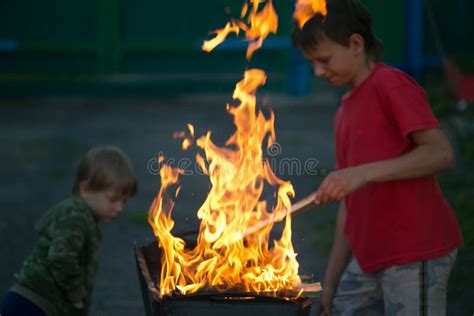 Children Play With Fire In The Grill Stock Image Image Of Fire