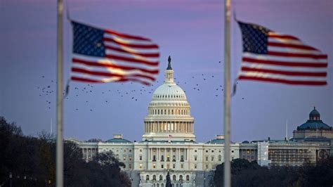 The Us Capitol With Flags At Half Staff As Former President George Hw