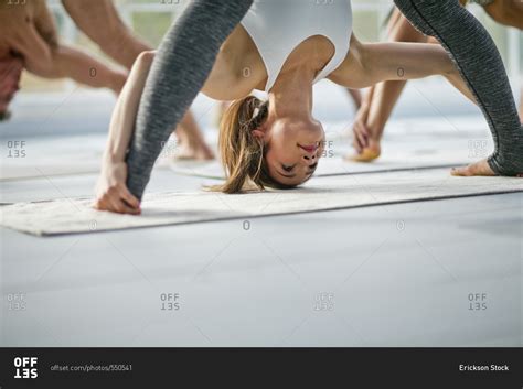 Babe Woman Bending Over During A Yoga Class Stock Photo OFFSET