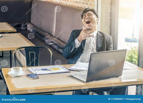 Tired Man Yawning At Workplace Stock Image Image Of Indoors Business