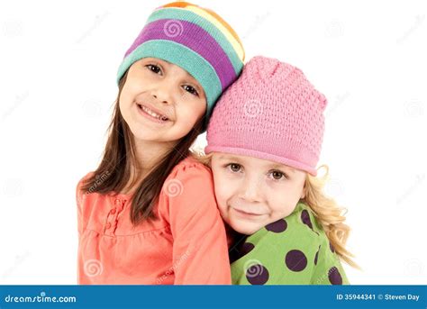 Two Adorable Girls Wearing Winter Hats Hugging Stock Image Image Of Female Christmas 35944341