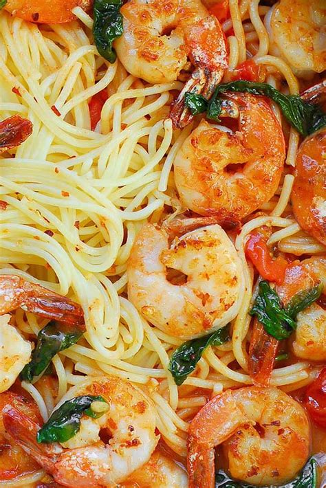 This creamy shrimp pasta recipe is one of my favorites. Garlic Shrimp Pasta in Red Wine Tomato Sauce - What's In The Pan? - My Recipe Magic