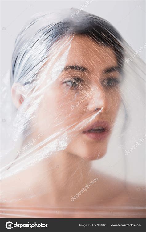 Naked Woman Open Mouth Covered Polyethylene Looking Away Isolated Grey Stock Photo By