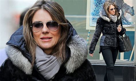 Elizabeth Hurley Wraps Up In A Chic Black Fur Lined Parka In New York City