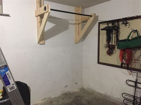 Sturdy, ceiling mounted pull up bar made from black pipe fittings from the hardware store. Diy Pullup Bar | Examples and Forms