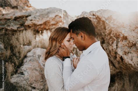 Mixed Race Couple In Love Embrace On Another Stock Photo And Royalty