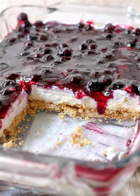 A Blueberry Cheesecake Is In A Glass Dish