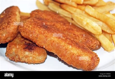 Oven Baked Golden Brown Fish Sticks With Oven Baked French Fries On The
