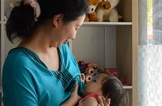 breastfeeding mom asian footage shutterstock mother baby her breastfeed