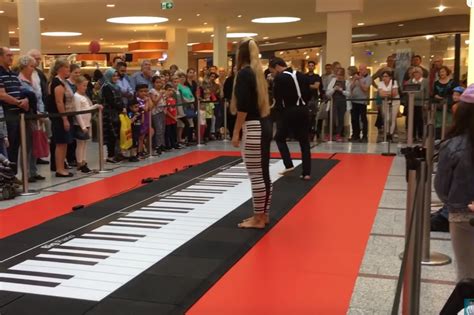 Duos Floor Piano Playing Draws Enthusiastic Crowd