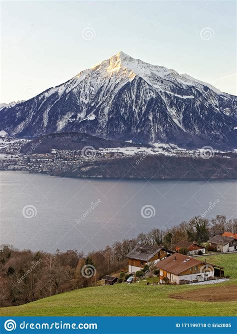 Swiss Lake View Near Thun With A View Of Niesen Peak In Winter Stock