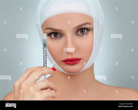 Woman With Syringe Beautiful Woman After Plastic Surgery With Bandaged