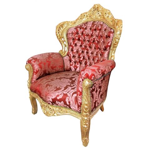 Crafted from metal, solid wood, and manufactured wood frame. Big baroque style armchair red "Gobelins" fabric and gold wood