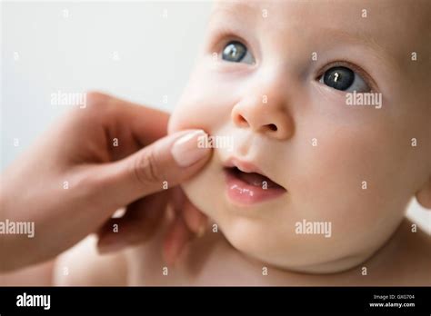 Pinching Cheek Hi Res Stock Photography And Images Alamy