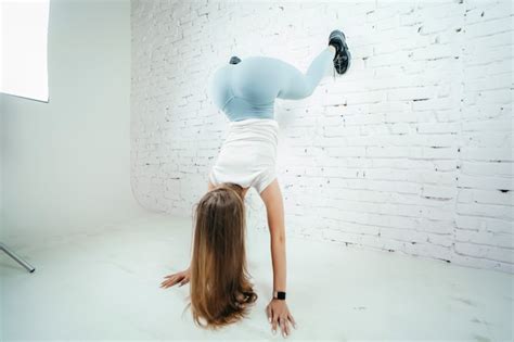 Premium Photo Twerk Woman In Blue Leggins Pants On White Background
