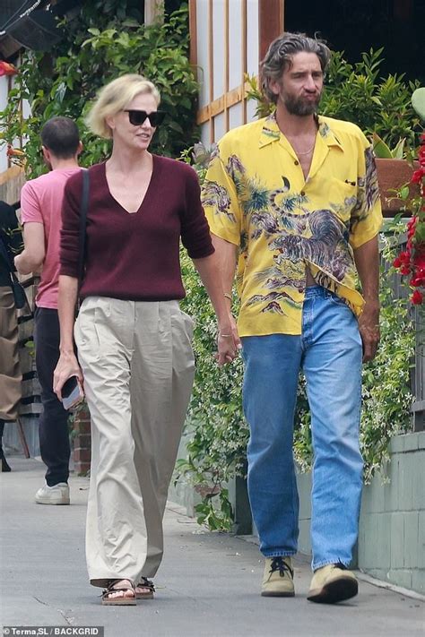 Charlize Theron S Secret New Love Mad Max Star Caught Holding Hands With Handsome Model