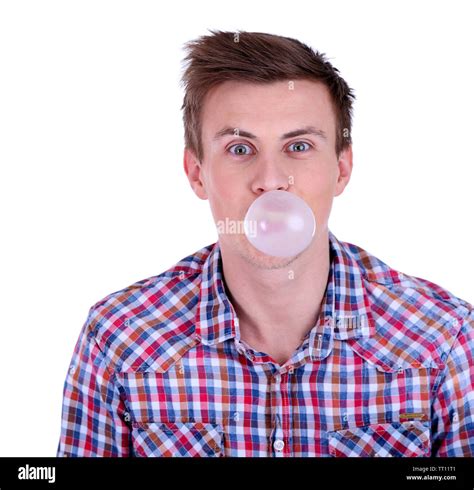 Young Man Blowing Bubble Of Chewing Gum Isolated On White Stock Photo