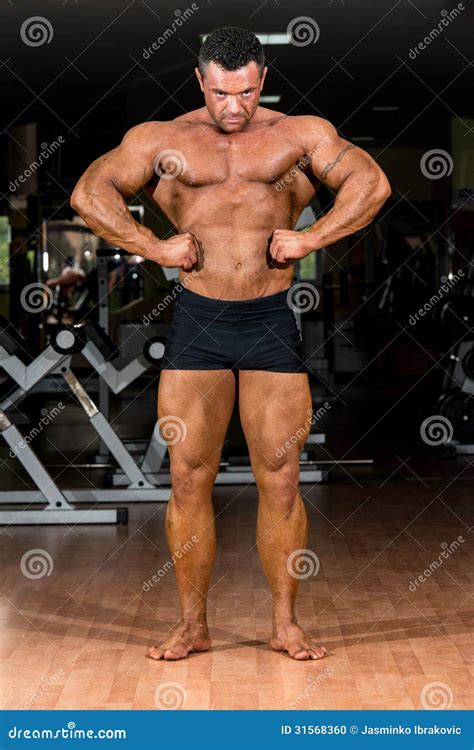 Muscular Bodybuilder Showing His Front Lat Spread Stock Photo Image