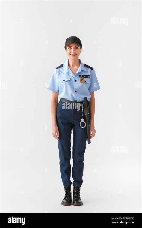 Female Police Officer On Light Background Stock Photo Alamy