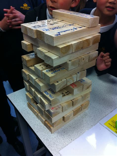 Giant Tower Jenga Students Write Questions On Wood Covered In Sticky