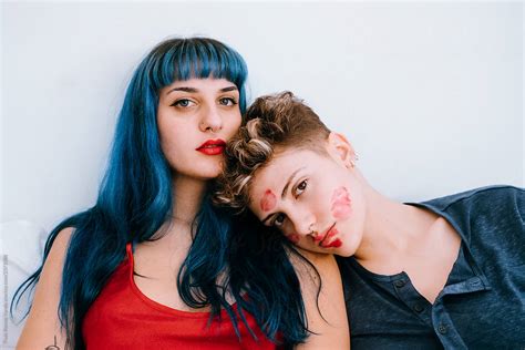 A Couple Of Lesbians In Bed Leave Lipstick Marks On Their Faces