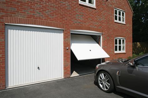 The canopy garage door has side arms and top springs. Types of Garage Doors and Which is More Suitable for ...