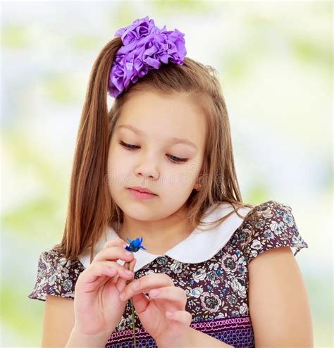 Beautiful Little Girl Looking At Blue Flower Stock Image Image Of