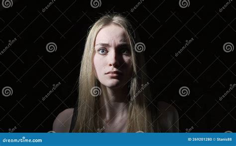 The Young Woman Shows Emotions Of Fear On Her Face Stock Photo Image