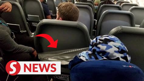 passenger taped to seat after allegedly groping flight attendants punching another youtube