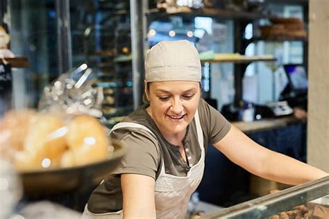 Two Saleswoman In A Bakery By Stocksy Contributor Miquel Llonch