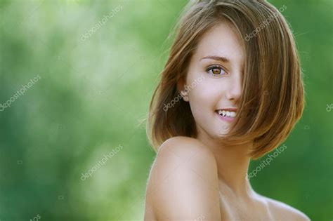 Smiling Beautiful Young Woman Close Up Stock Photo By ©bestphotostudio